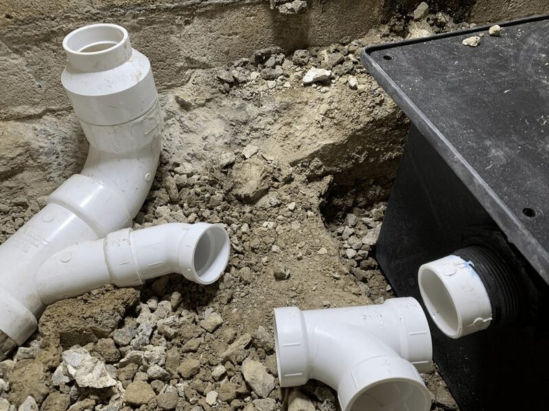 Smith plumbing installation showing fresh PVC pipework on a Colorado home